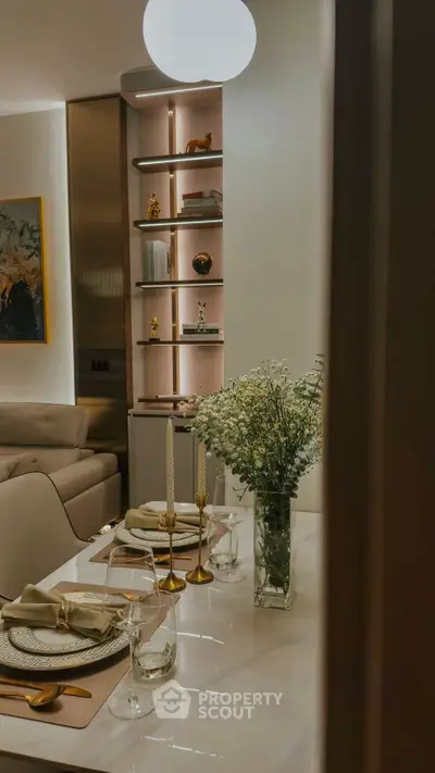 Elegant dining area with modern decor and ambient lighting in a stylish apartment.