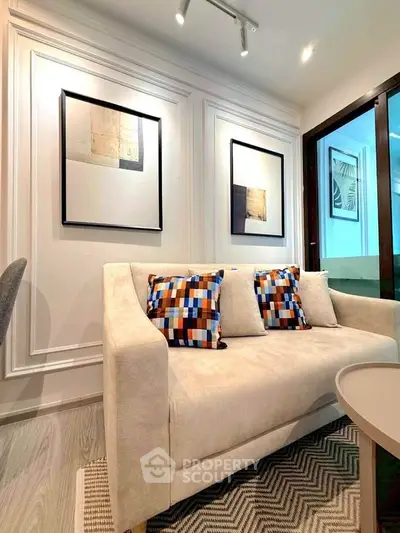 Stylish living room with modern decor and cozy seating in a contemporary apartment.