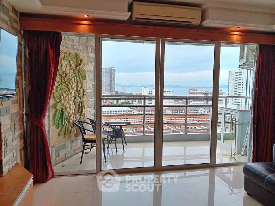 Luxurious living room with stunning city view and spacious balcony