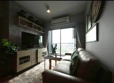 Cozy living room with modern decor and balcony view