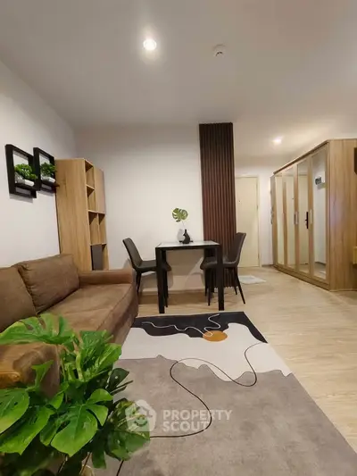 Modern living room with stylish decor and cozy seating area in a contemporary apartment.