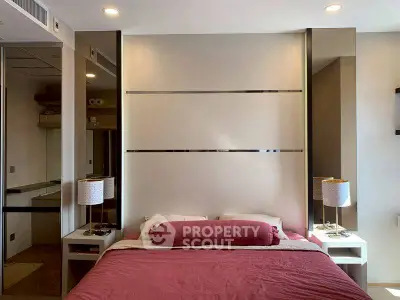 Modern bedroom with stylish decor and cozy ambiance, featuring elegant bedside lamps and a plush bed.