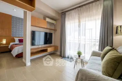 Modern studio apartment with cozy living area and natural light