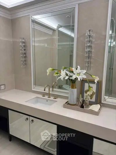 Luxurious bathroom with elegant vanity and floral decor