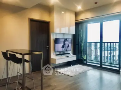 Modern living room with sleek design and large balcony view