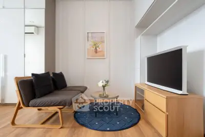Modern living room with stylish furniture and wooden flooring