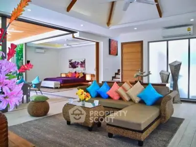 Luxurious open-plan living room with vibrant decor and modern furnishings