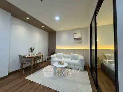 Modern living room with cozy seating and elegant dining area