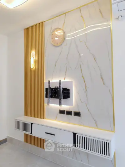 Modern living room with elegant wall paneling and stylish lighting