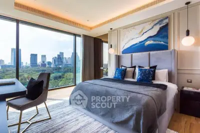 Luxurious bedroom with stunning city view and modern decor in high-rise apartment.