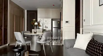 Modern living room with elegant dining area and sleek kitchen design