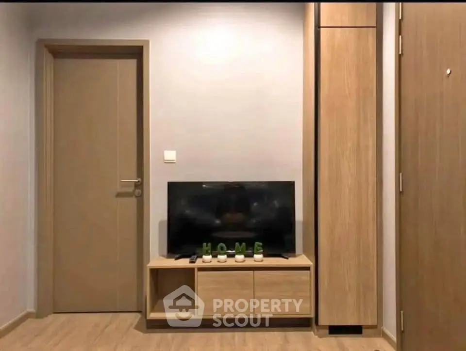 Modern living room with sleek wooden TV stand and minimalist decor