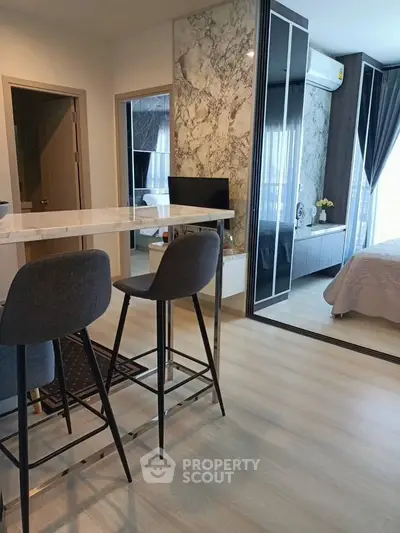 Modern apartment interior with stylish kitchen and cozy bedroom
