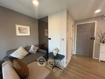 Modern living room with cozy gray sofa and stylish decor