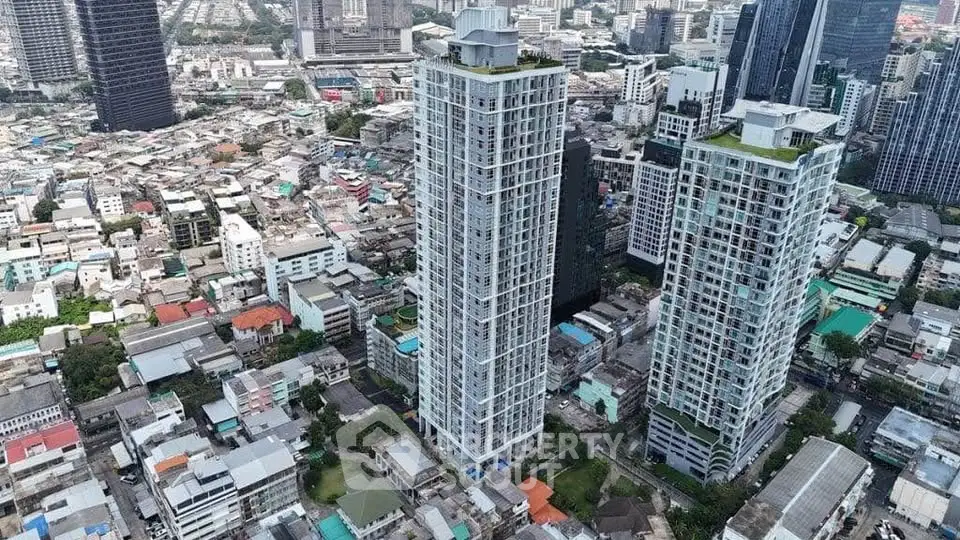 Stunning aerial view of modern high-rise buildings in a bustling urban landscape.