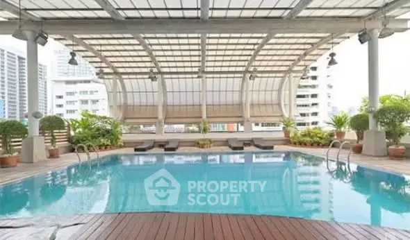 Luxurious rooftop pool with city views and modern design, perfect for relaxation and leisure.