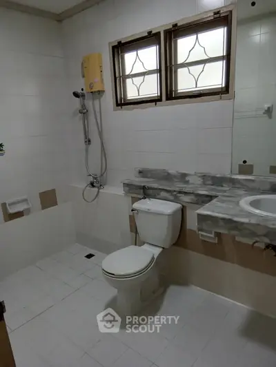 Spacious bathroom with modern fixtures and natural light