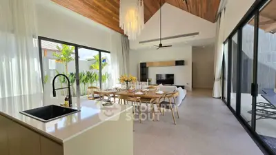 Luxurious open-plan living room with modern kitchen and elegant dining area in a stylish home.