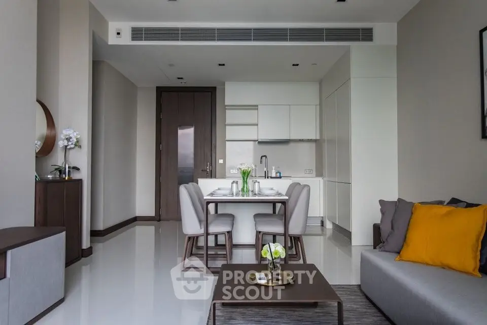 Modern living room with dining area and sleek kitchen design