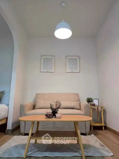 Cozy living room with modern decor and neutral tones, perfect for relaxation.