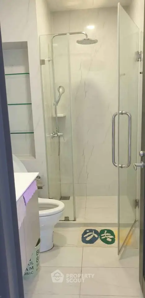 Modern bathroom with glass shower enclosure and sleek design