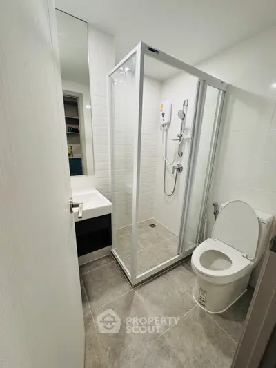 Modern bathroom with glass shower and sleek fixtures