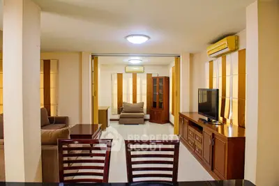 Spacious living room with modern furniture and air conditioning, perfect for relaxation and entertainment.