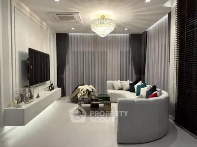 Luxurious living room with elegant chandelier and modern decor