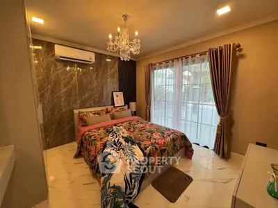 Luxurious bedroom with elegant chandelier and large window view
