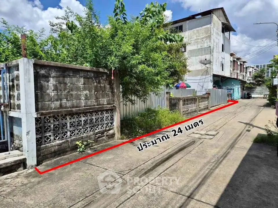 Urban street view with residential buildings and clear sky