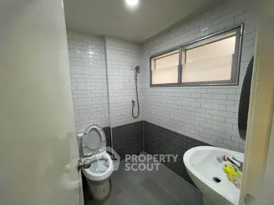 Modern bathroom with sleek tiles and contemporary fixtures