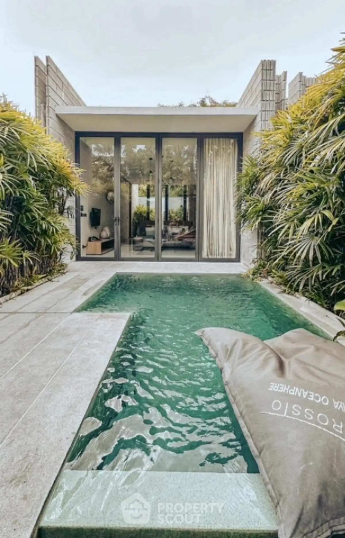Luxurious villa with private pool and modern design surrounded by lush greenery