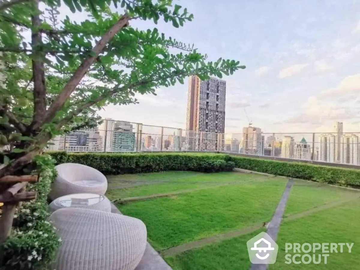 Luxurious rooftop garden with stunning city skyline view and modern seating area.