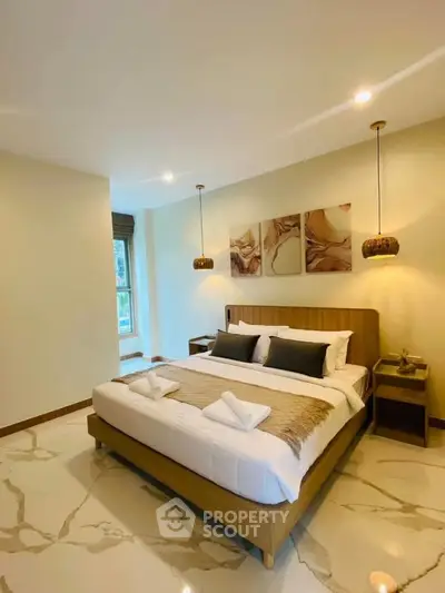 Luxurious bedroom with elegant decor and modern lighting