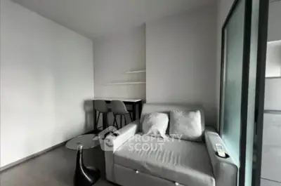Modern living room with sleek furniture and minimalist design, perfect for urban living.