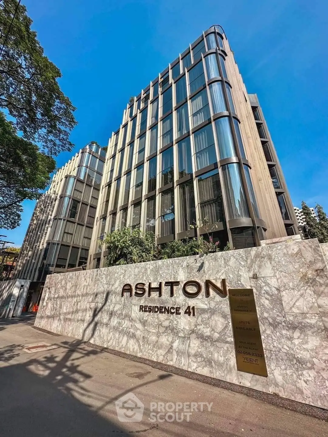 Modern luxury residential building with sleek design and elegant facade in prime location.