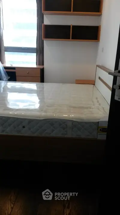 Cozy bedroom with modern shelving and natural light