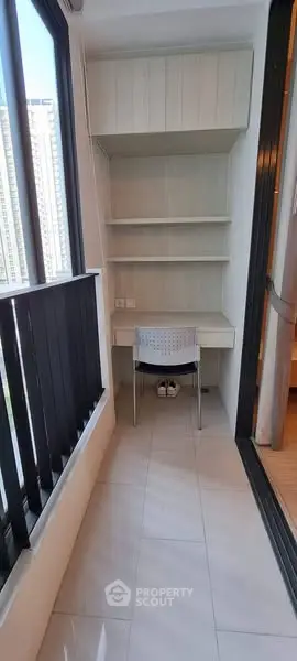 Compact study nook with built-in shelves and desk in modern apartment