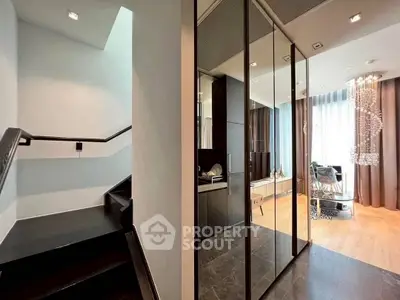 Modern interior with elegant staircase and stylish living area