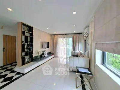 Spacious modern living room with elegant decor and large windows