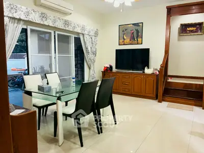 Charming dining area with modern glass table and elegant decor
