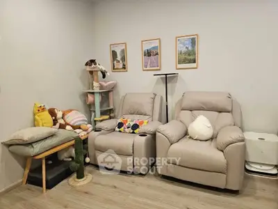 Cozy living room with plush recliners and cat tree, perfect for relaxation.