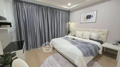 Elegant bedroom with plush bed, modern decor, and soft lighting