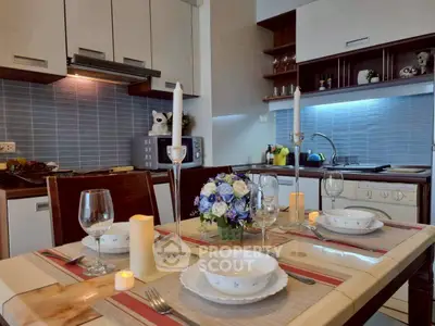 Elegant kitchen with dining setup, featuring modern appliances and stylish decor for a cozy dining experience.