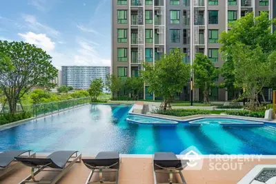 Luxurious condominium with stunning pool and lush garden view