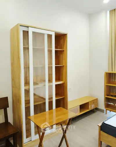 Modern bedroom with wooden furniture and ample storage space