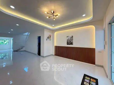 Spacious modern living room with elegant lighting and sleek flooring