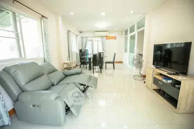 Spacious living room with modern furniture and natural light