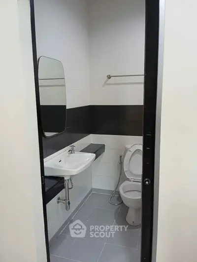 Modern bathroom with sleek design and essential fixtures