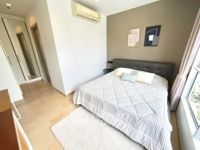 Modern bedroom with stylish decor and natural light